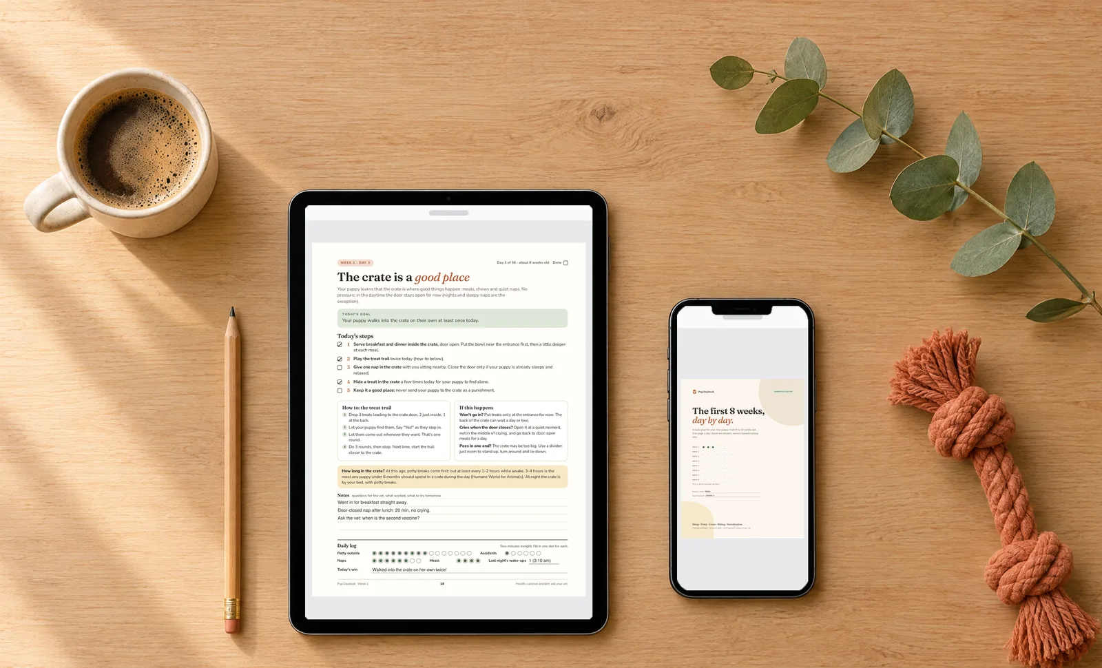 A filled-in Pup Daybook page on a tablet and the cover on a phone